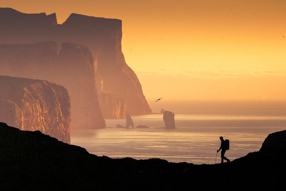 World's Edge Kalsoy island Faroe Islands fine art photography print lone hiker golden cliffs