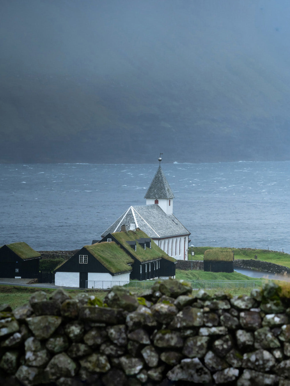 Viðareiði church Faroe Islands fine art photography print white church stone walls dramatic sky